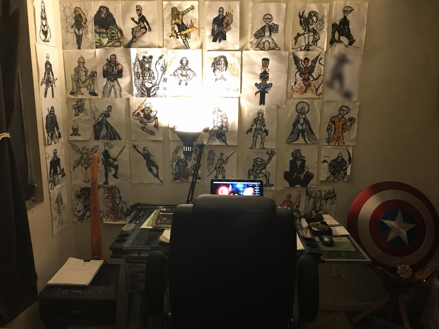 Chandler Windham in his workspace surrounded by original artwork